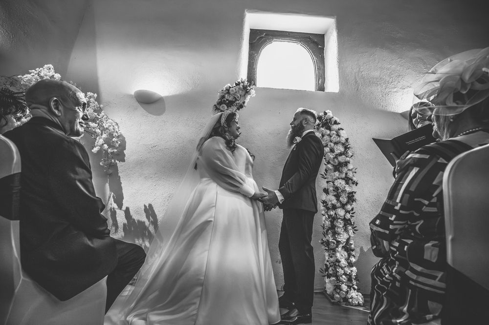 A black and white photo collage shows a wedding celebration with dancing, flowers, and formal attire.