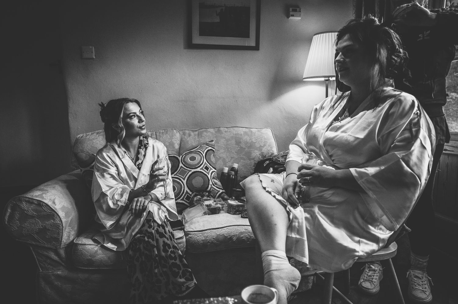 A series of black and white photographs showing a person lying in a hospital bed during childbirth.