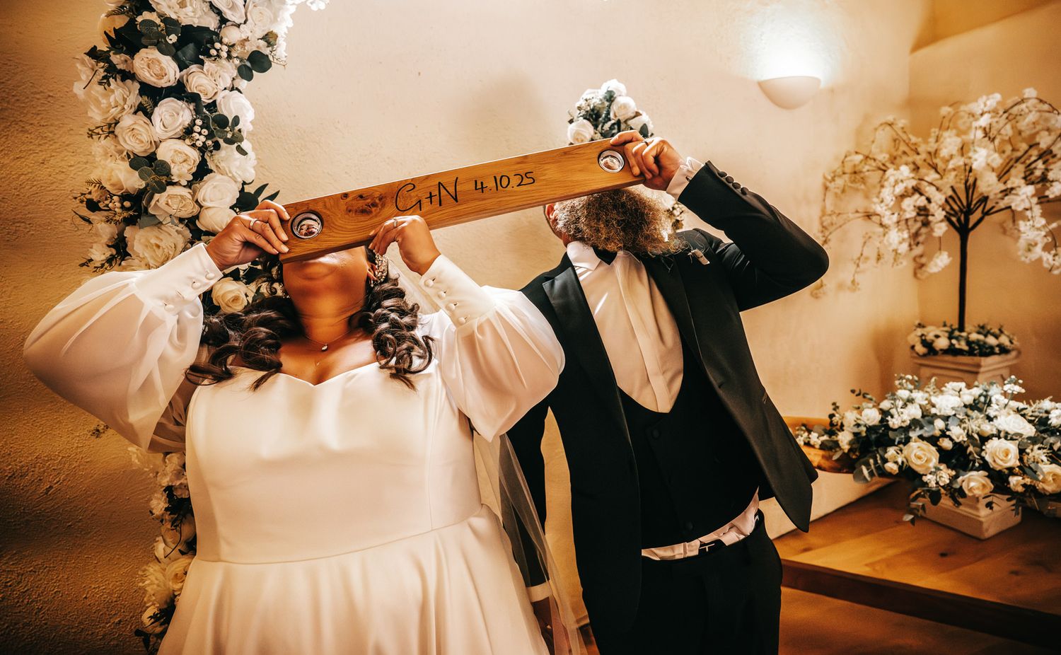 A series of wedding photos showing intimate moments and details in warm golden lighting at an elegant venue.