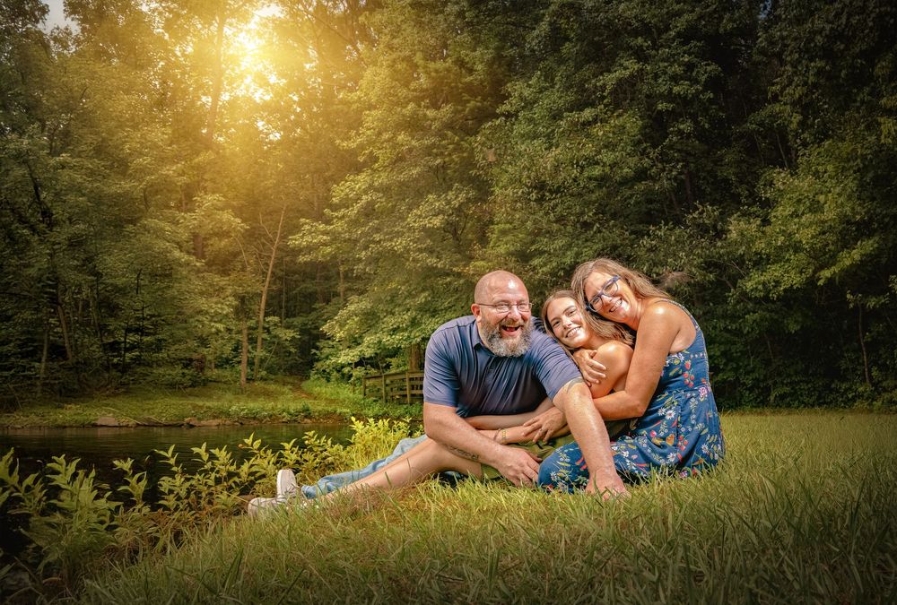 A series of romantic sunset photos in a golden meadow shows tender moments between a couple during a summer evening session.