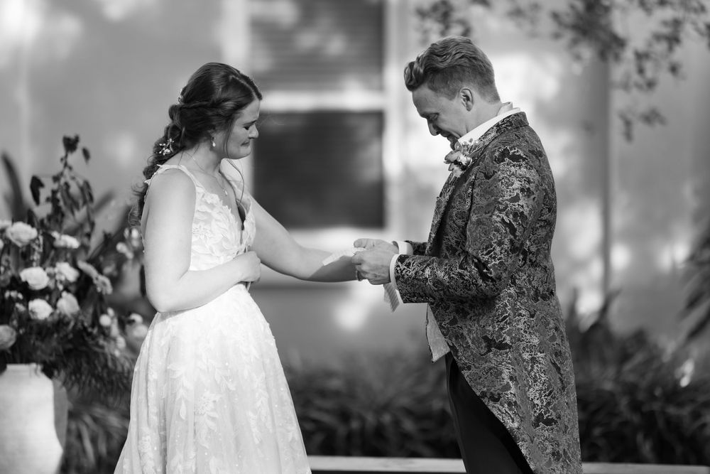 A romantic black and white photo collage showing tender moments between a couple on their wedding day.