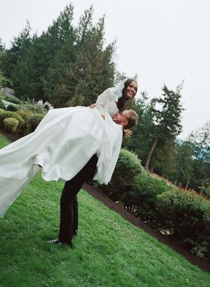 Playful outdoor wedding photo sequence showing a couple having fun with flowing white fabric on a grassy hillside.