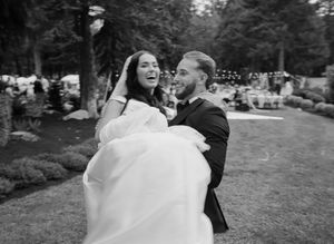 A series of black and white wedding photos showing romantic moments between a couple outdoors.