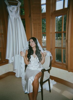 A series of artistic shots showing a white wedding dress displayed in a sunlit room with wooden windows.