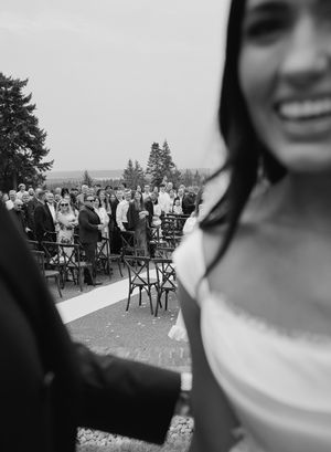 Black and white candid wedding photos showing guests mingling outdoors at a reception.