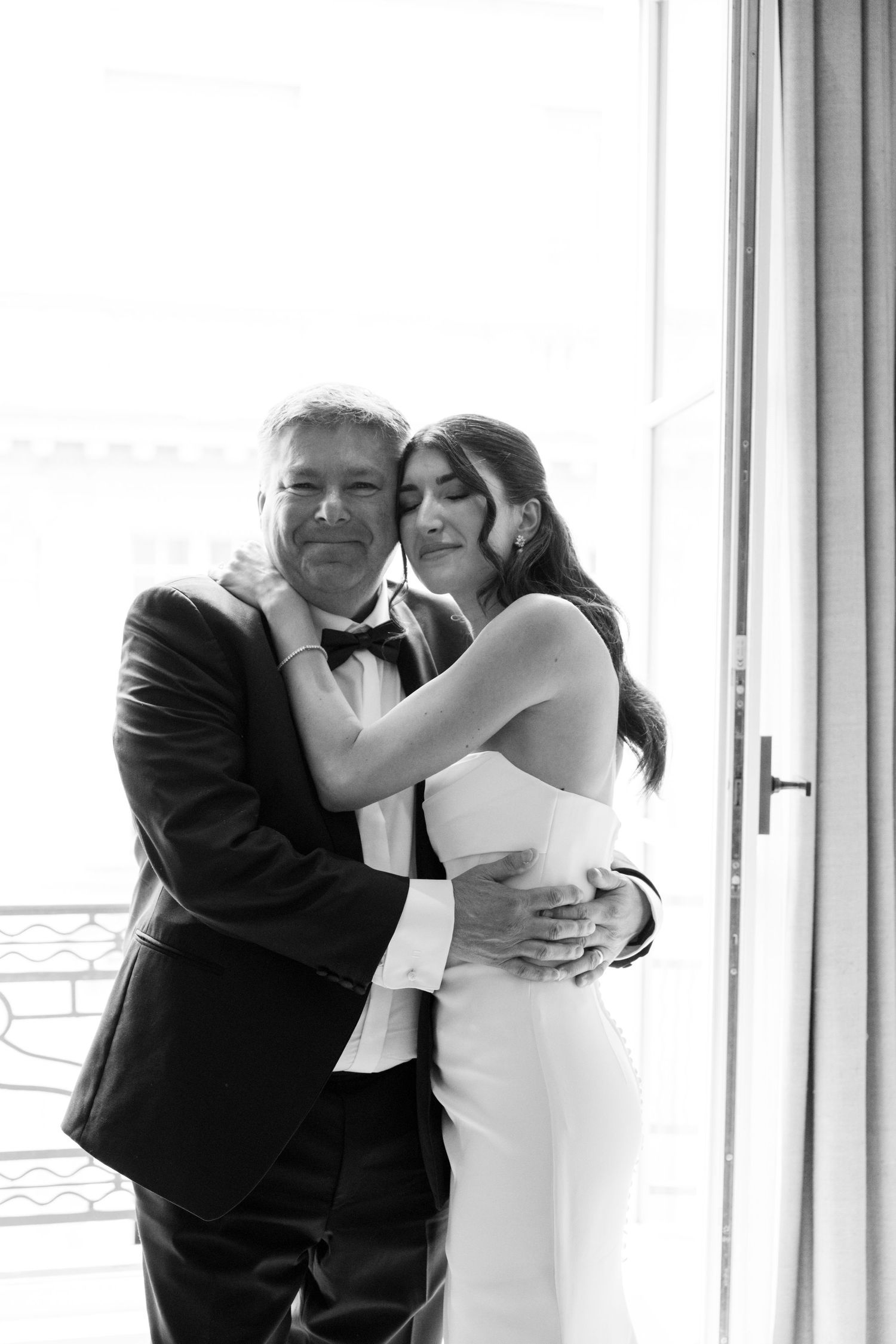A romantic black and white wedding photo sequence showing a couple sharing their first kiss as newlyweds.
