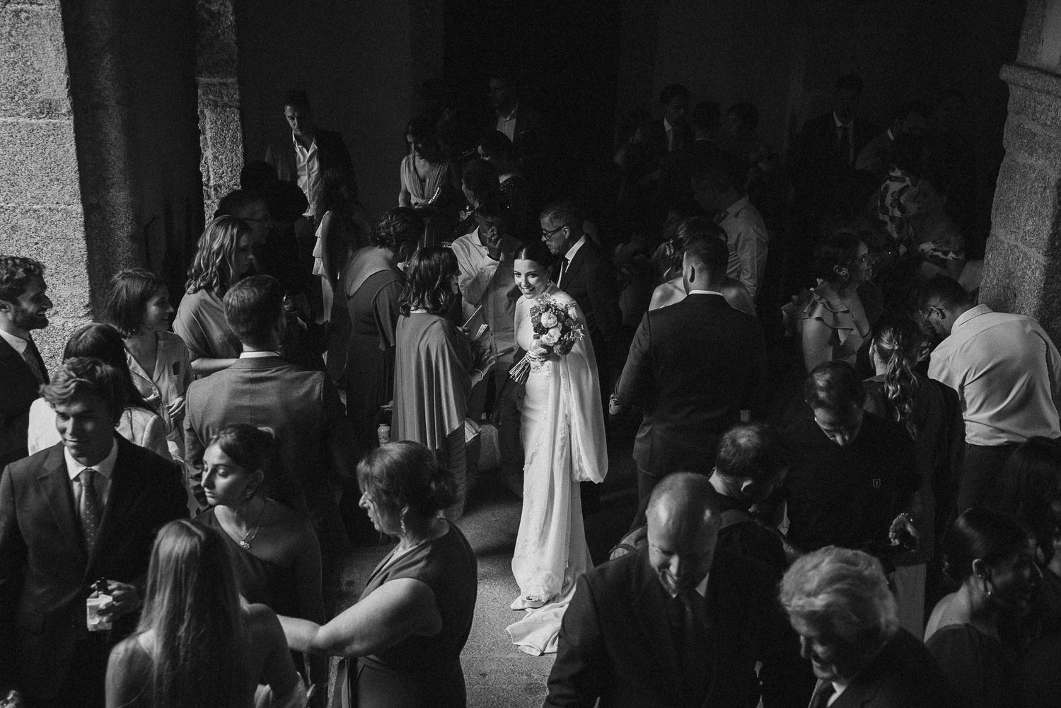 A crowd of people dancing and celebrating at a lively party or nightclub event.