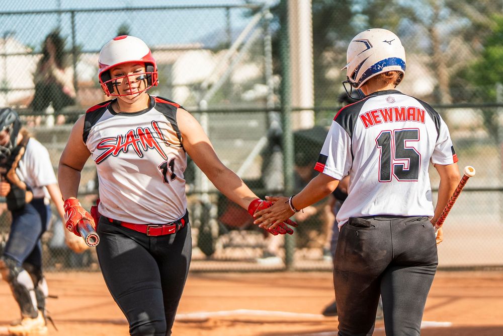 Girls softball players after gaining a point