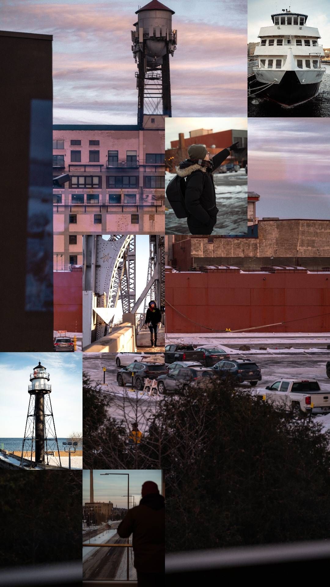 Industrial waterfront with lighthouse and pink buildings at sunset.