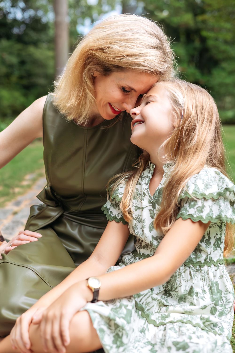 Mom and daughter share a sweet moment while siting on a stone path during their family photography mini session in Athens GA