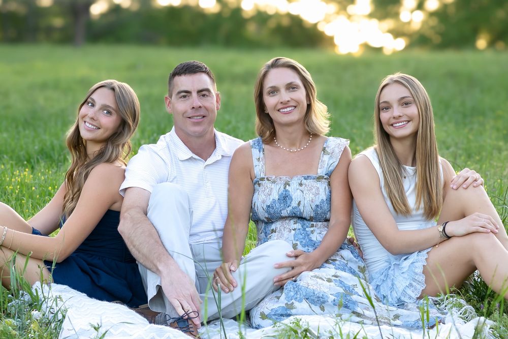 Family posing in flowers at Botanical Gardens Athens GA spring session