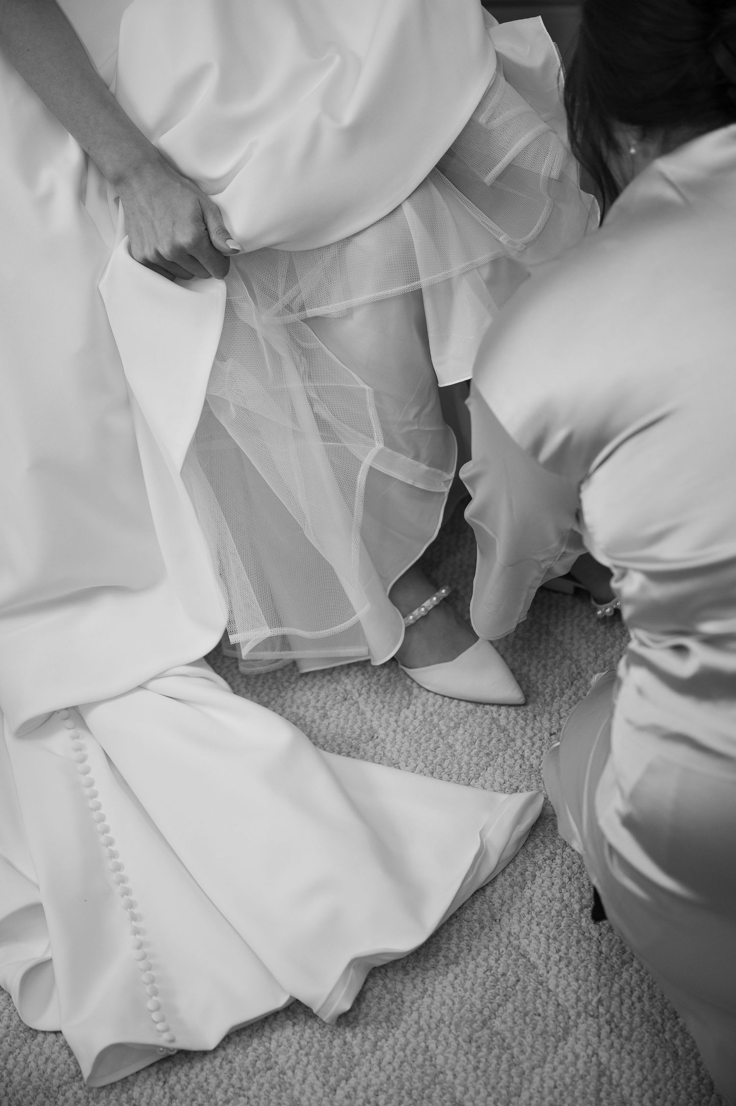Bride getting her shoes on
