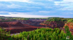 Panoramic landscape views of red rock canyons and green forests under blue skies in Utah's national parks.