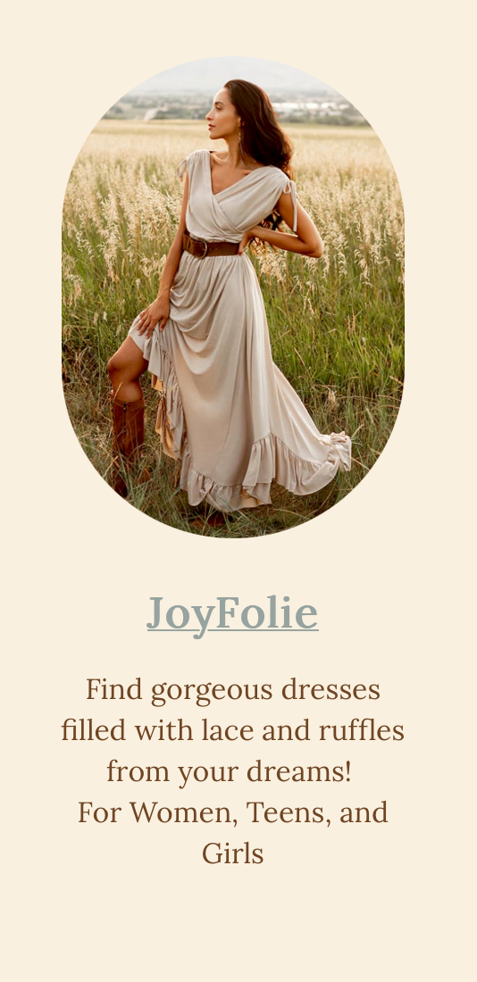 Ethereal draped dress flowing in field at sunset with rustic boots.