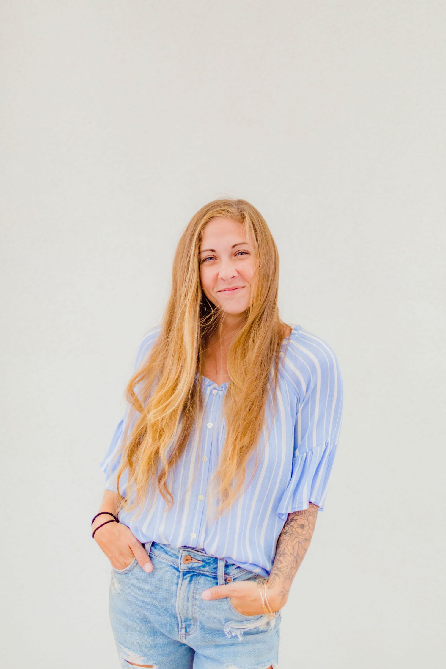 Portrait series against white background featuring casual blue top and denim styling. best hawaii family photographer kihei wailea kaanapali