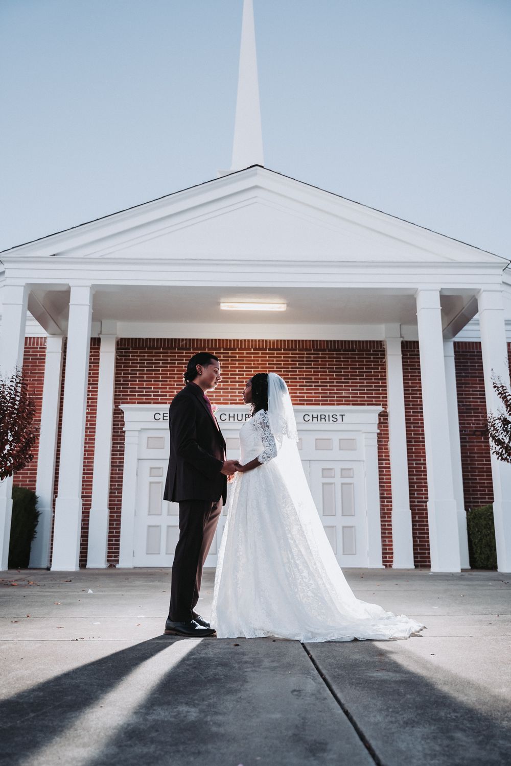 Dramatic wedding photo outside church