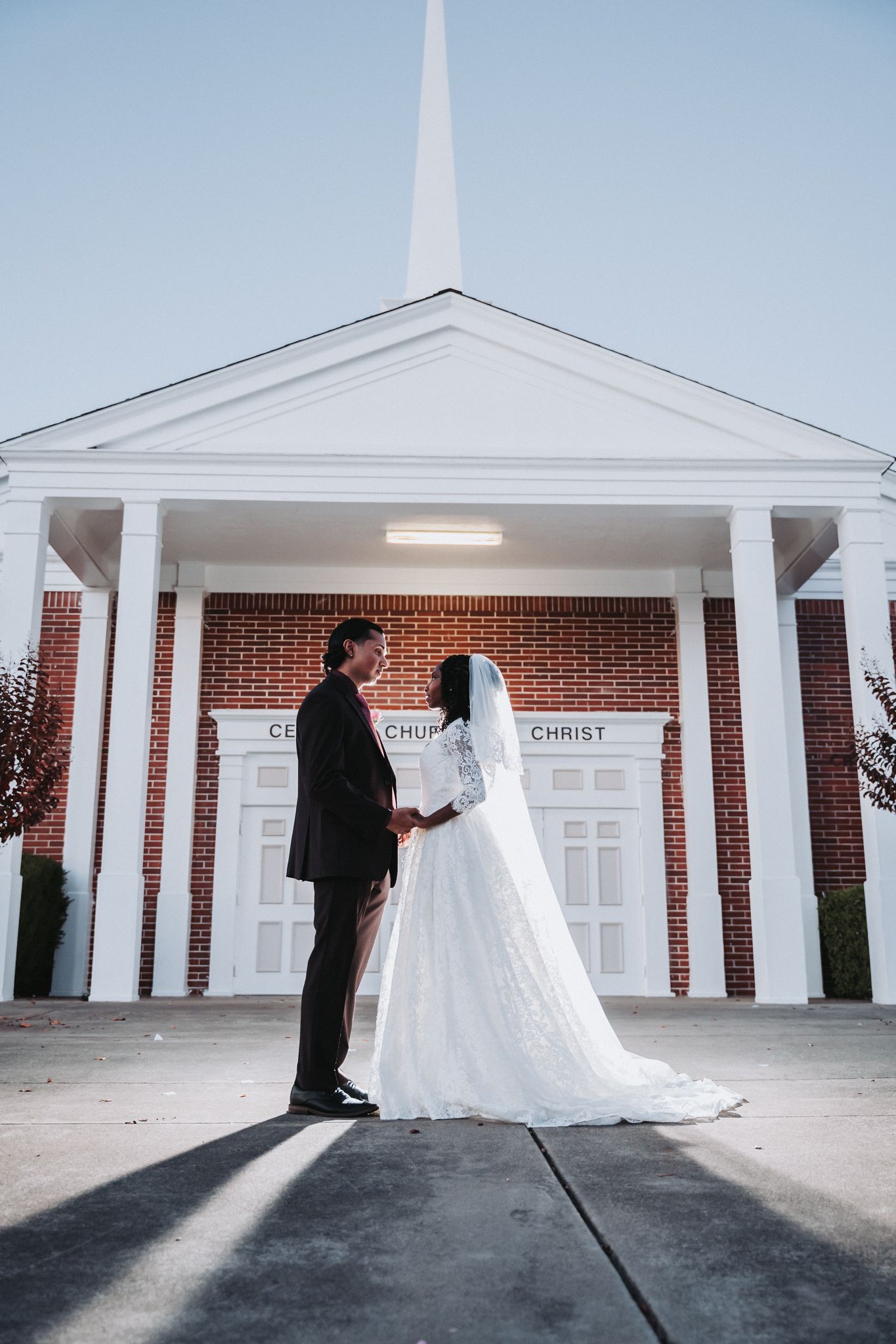 Dramatic wedding photo outside church