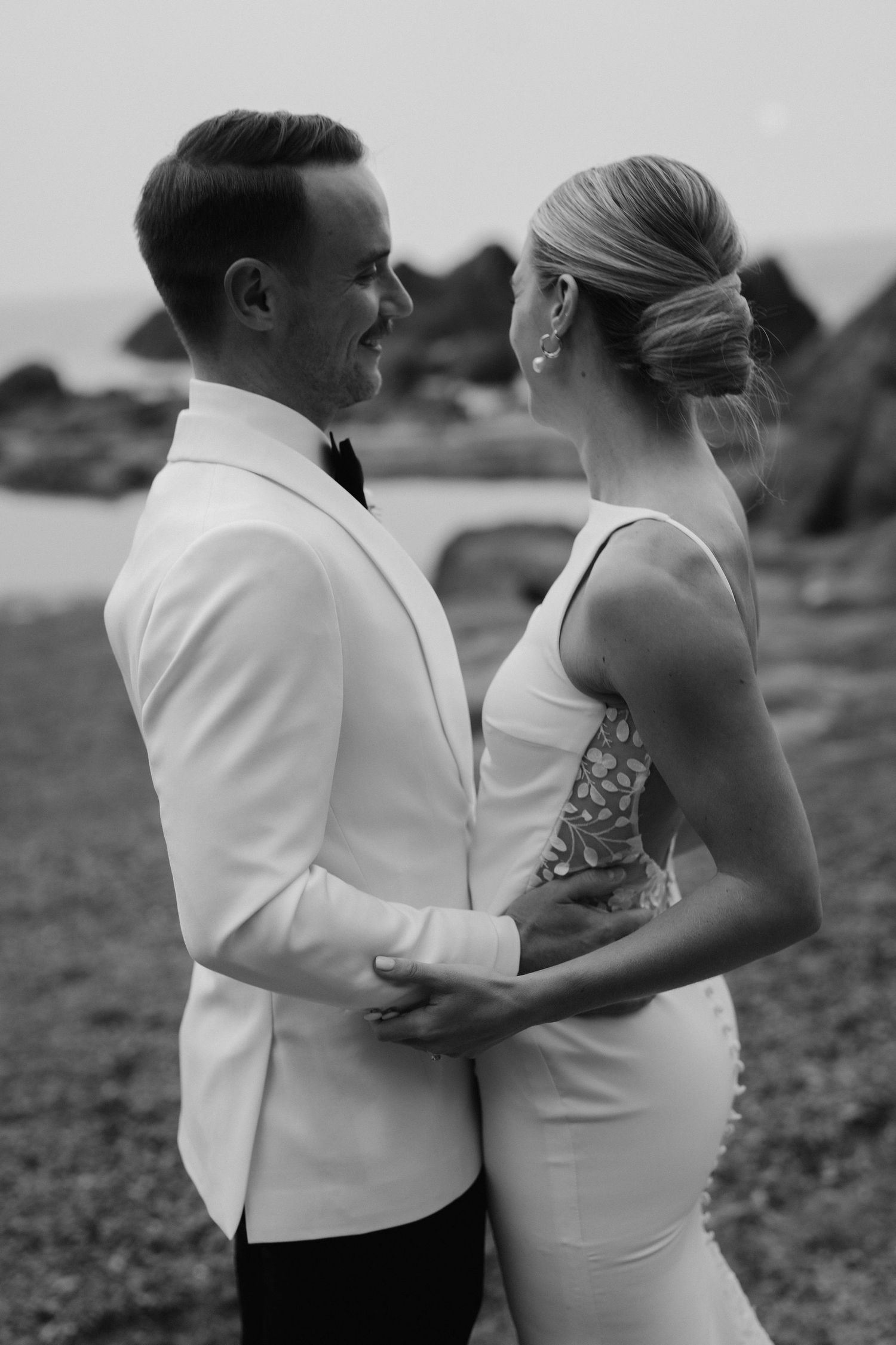 Bride and Groom on beach during sunset at tunnels beach wedding venue in north Devon