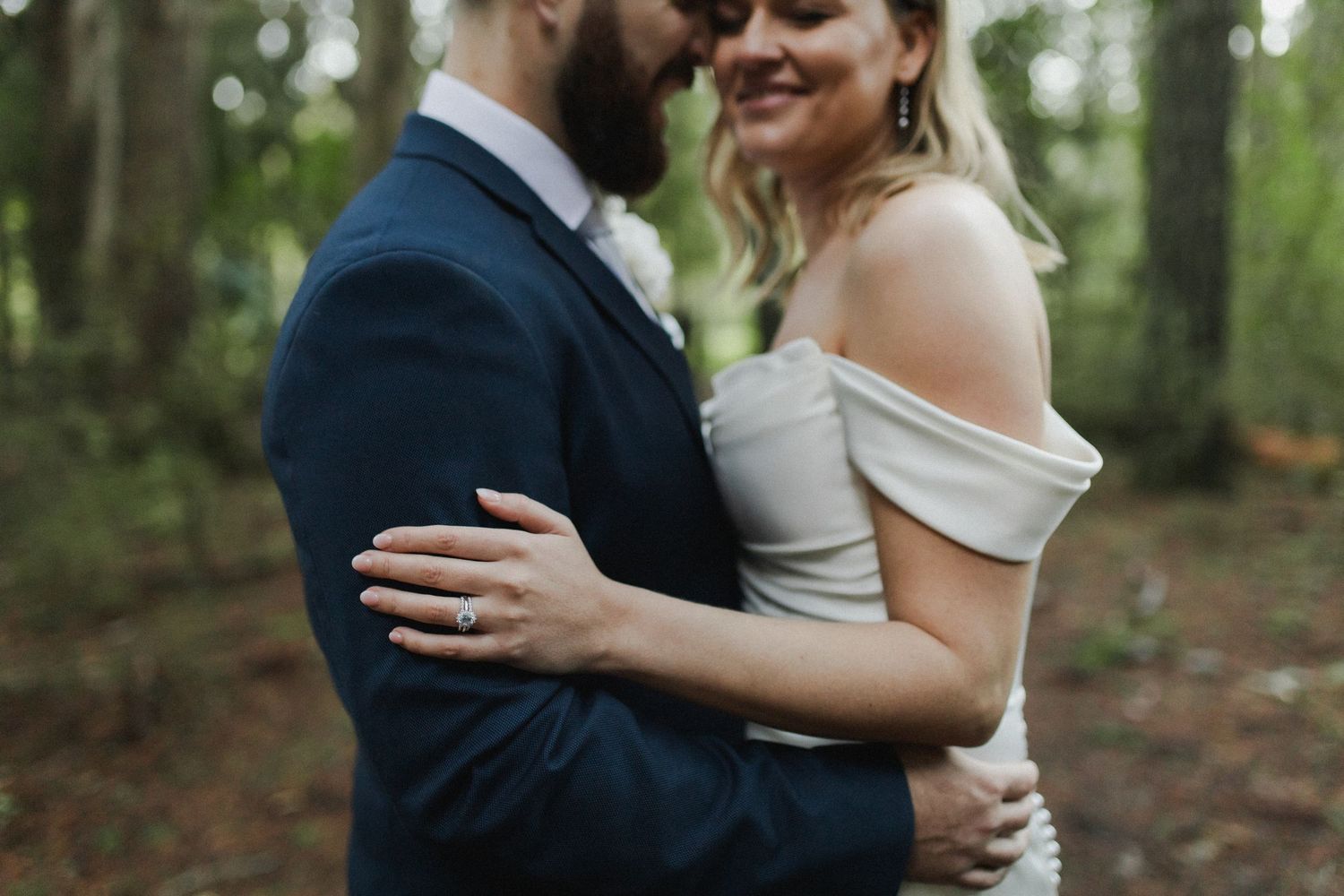 close up over husband and wife holding each other wedding photoshoot hamilton nz