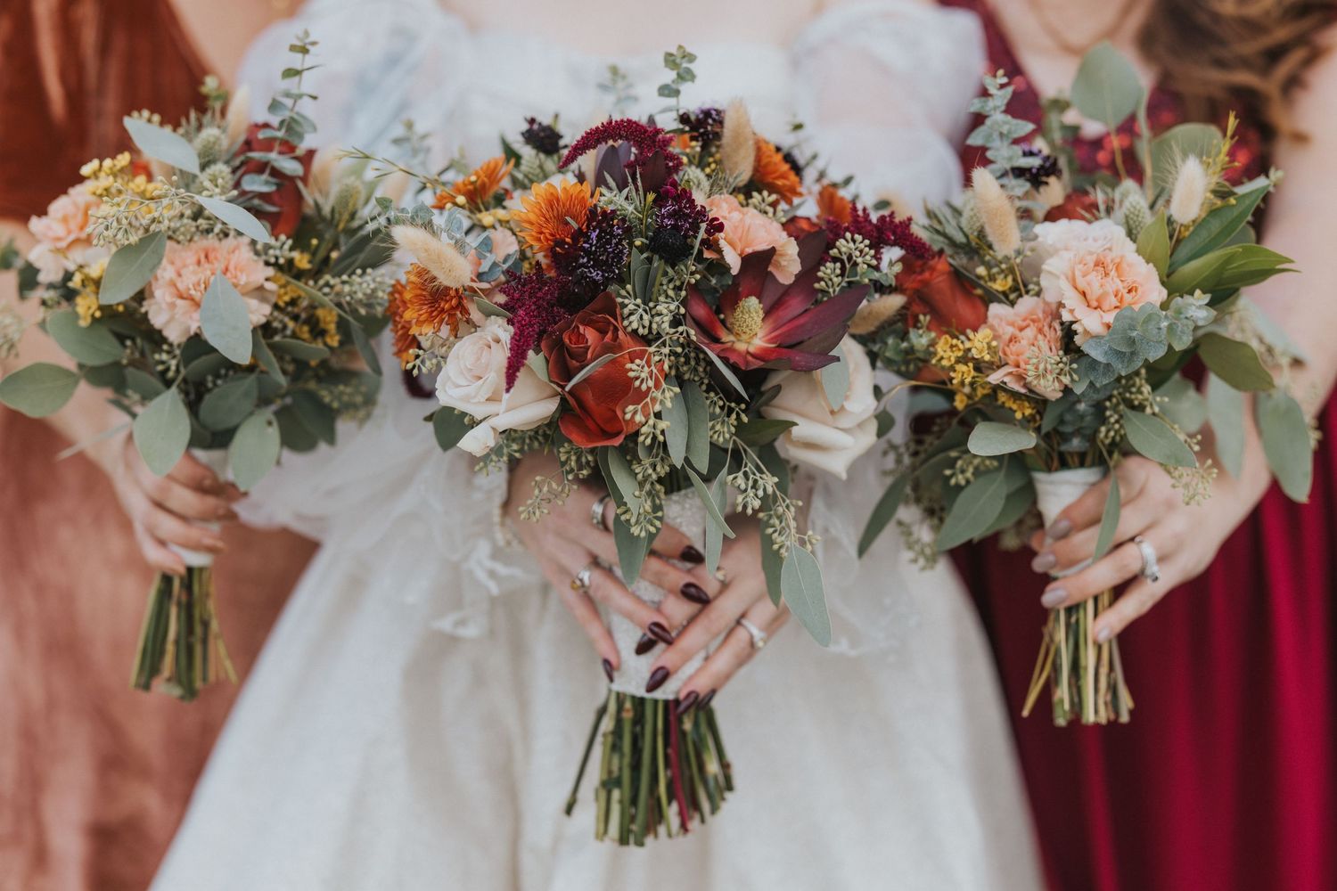 Colorful Fall Wedding Bouquets featuring peach, burgundy and pink flowers with greenery | Bride & Bridesmaids | Oxford Wedding Photographer