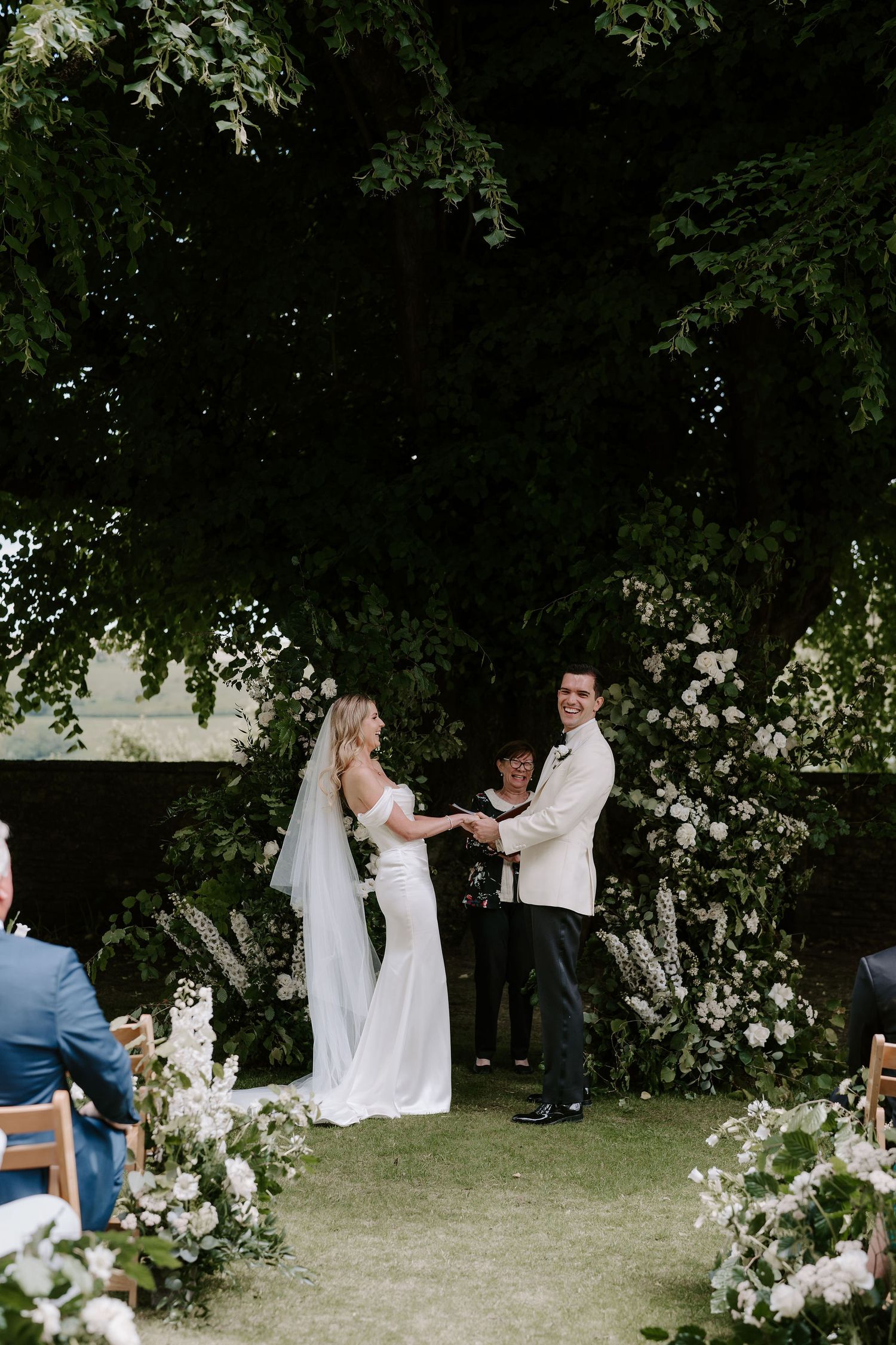 bride and groom laughing during ceremony at Hamswell house in bath