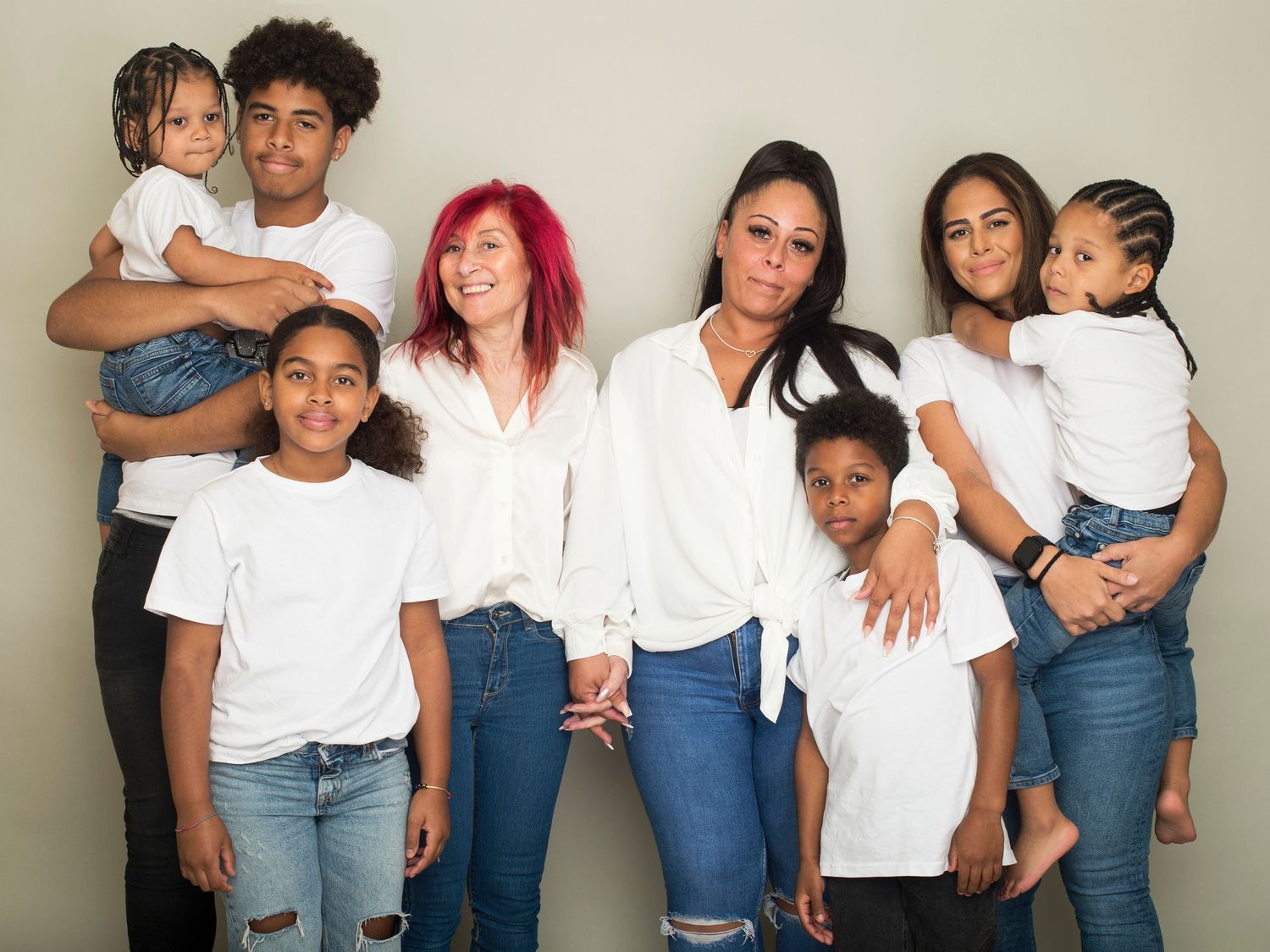 Family portrait featuring five individuals in white shirts and jeans, captured by Abigail's Studio in Buckinghamshire.