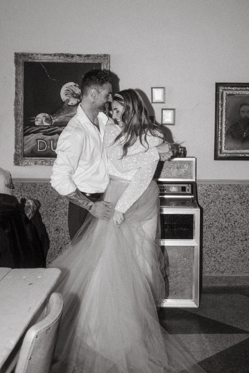 Romantic black and white photo in retro diner setting.