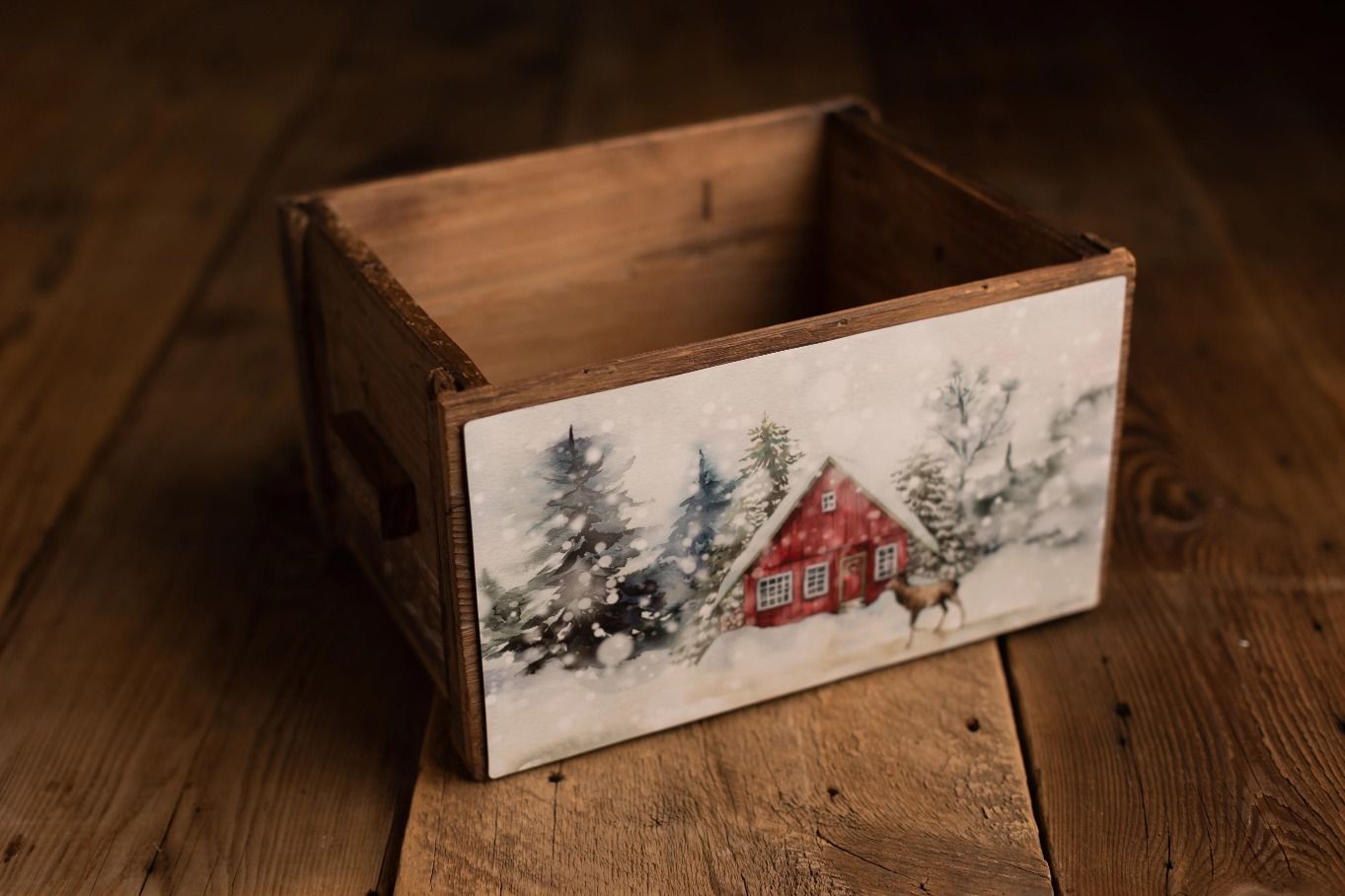 Rustic wooden crate decorated with a winter Christmas farmhouse scene painting.