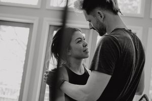 Black and white image capturing an intimate dance moment between two partners.