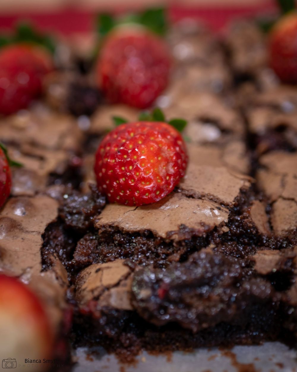 Chocolate brownie with strawberry on top