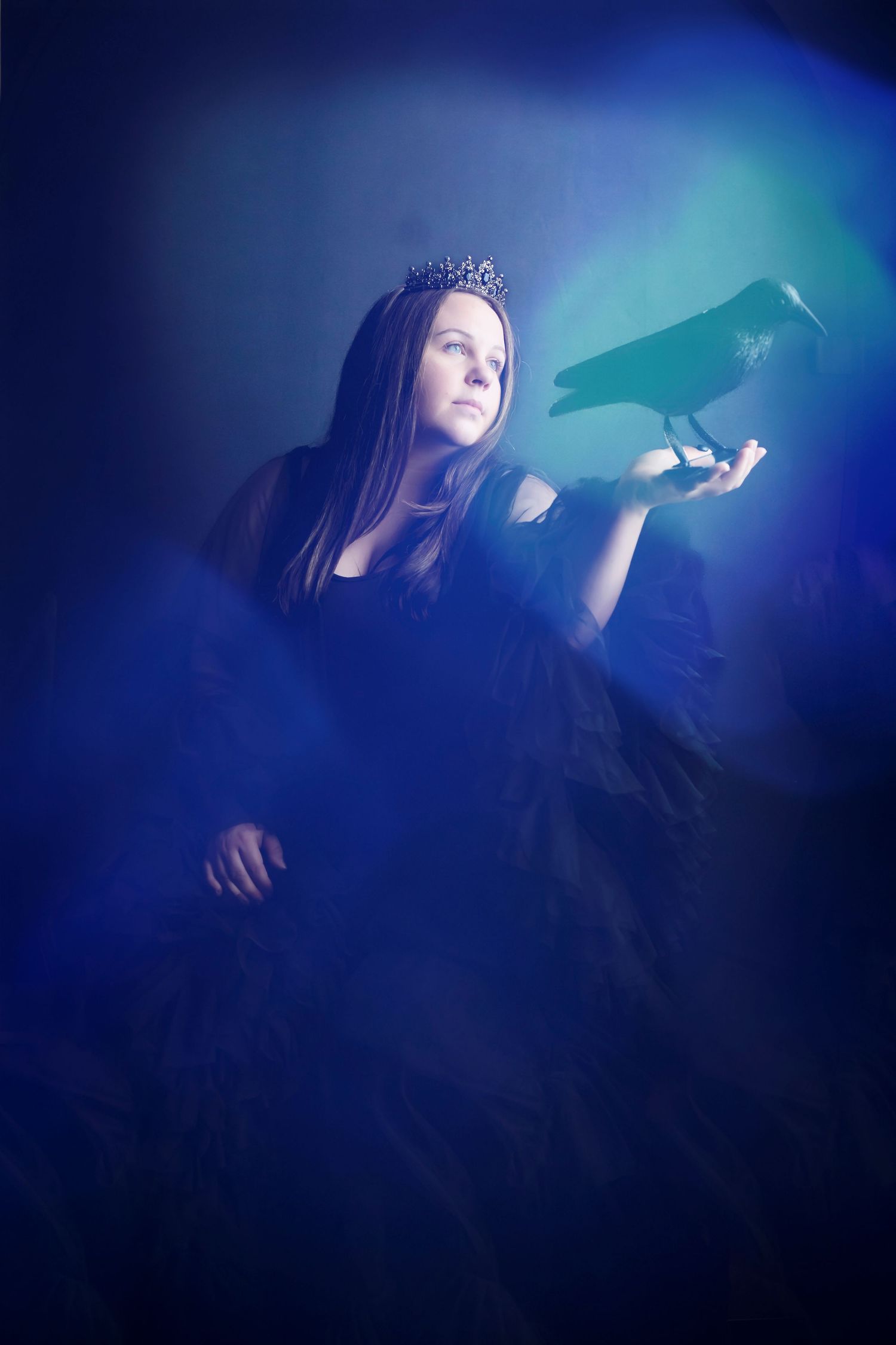 Atmospheric portrait series showing a figure in dark lighting against blue tones creating a dreamy, ethereal mood.
