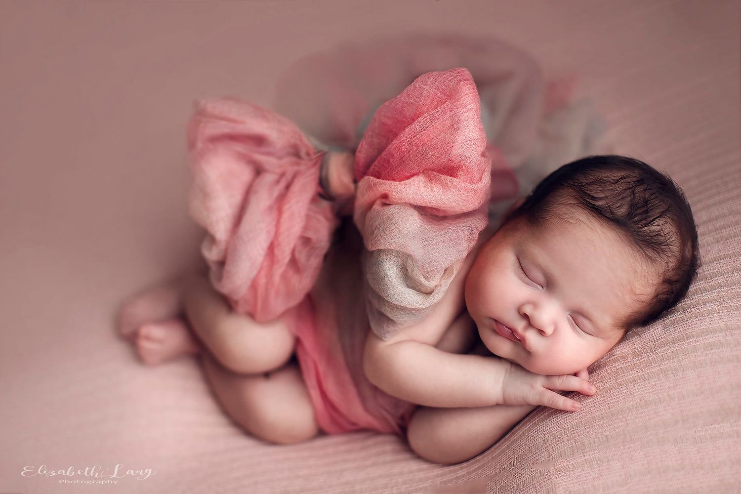 fabrics for wrapping your baby a pink bow and a baby girl .