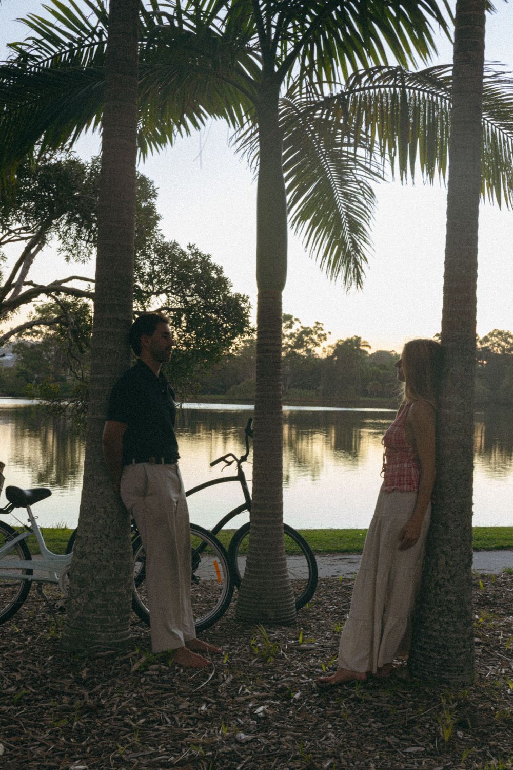 Couple bike riding at sunset captured in a cinematic golden hour photoshoot