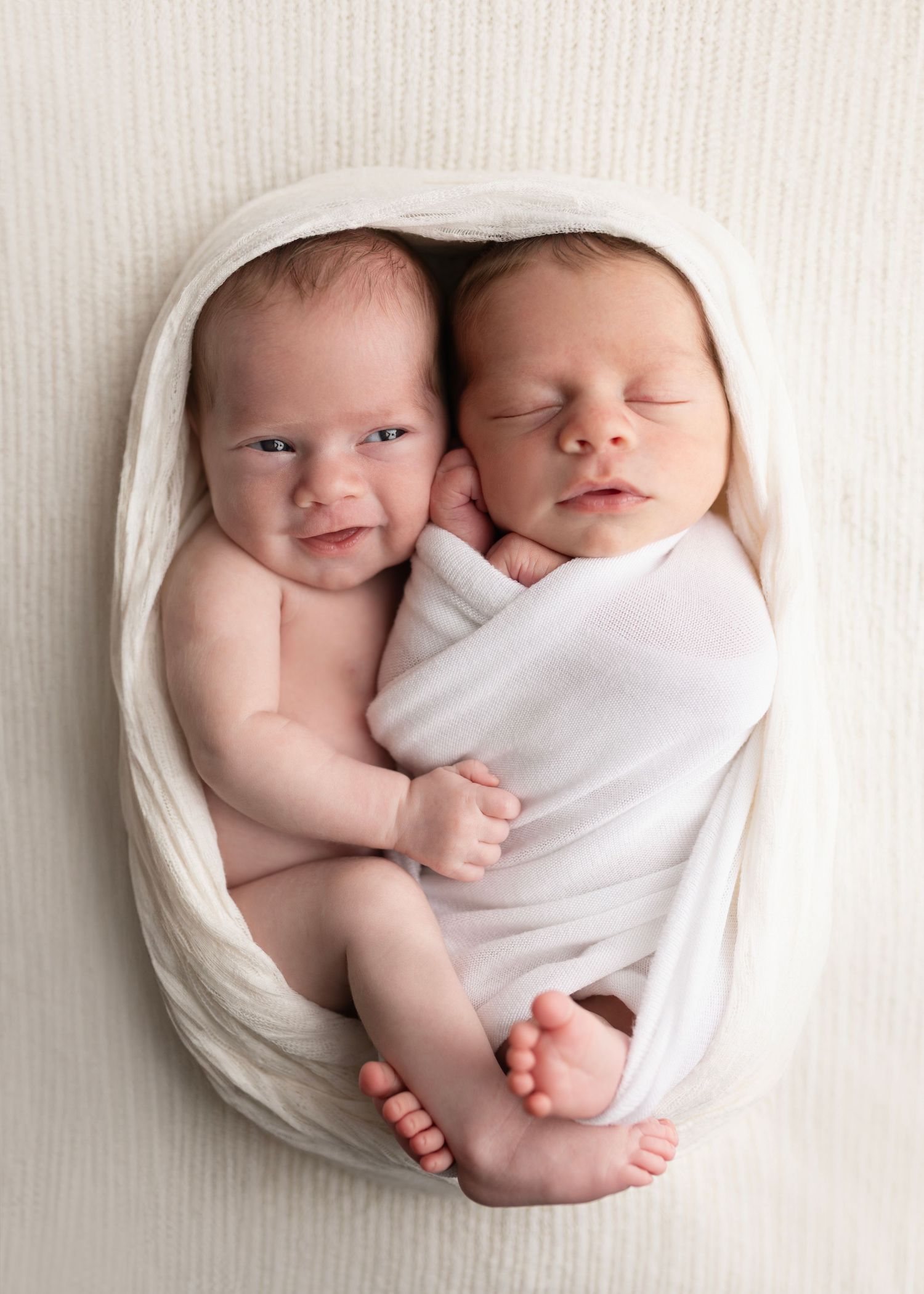 Newborn Photos for Janina's Photo session Cloverdale Family Photos Elizabeth Lang Photography. Studio.  twins cuddles up