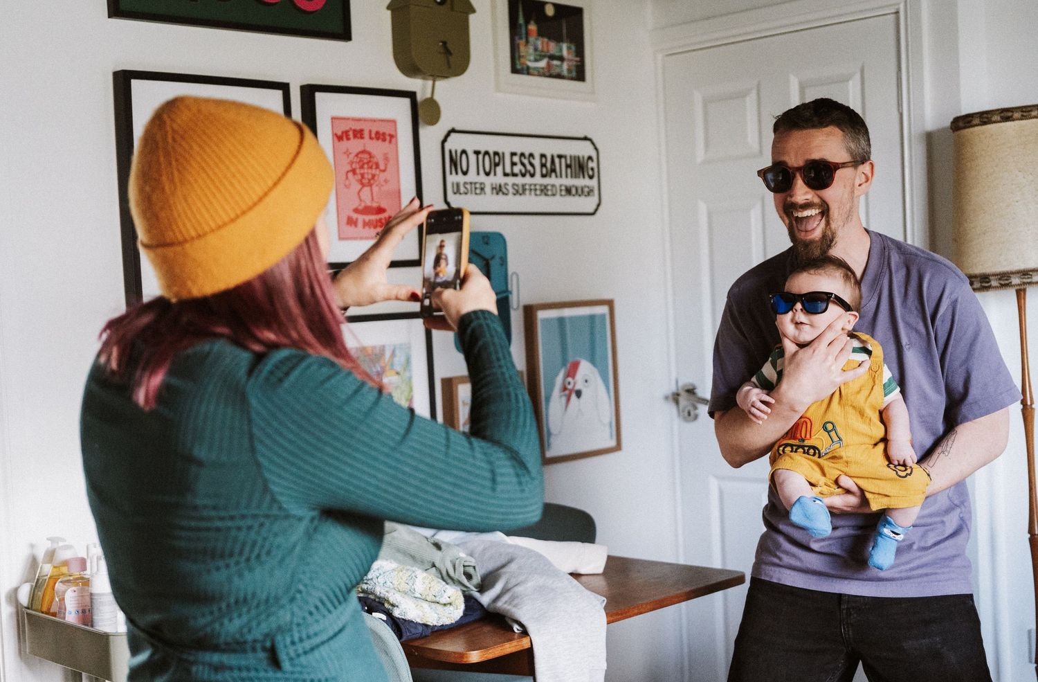 A series of candid photos showing people hugging and embracing in casual indoor settings.