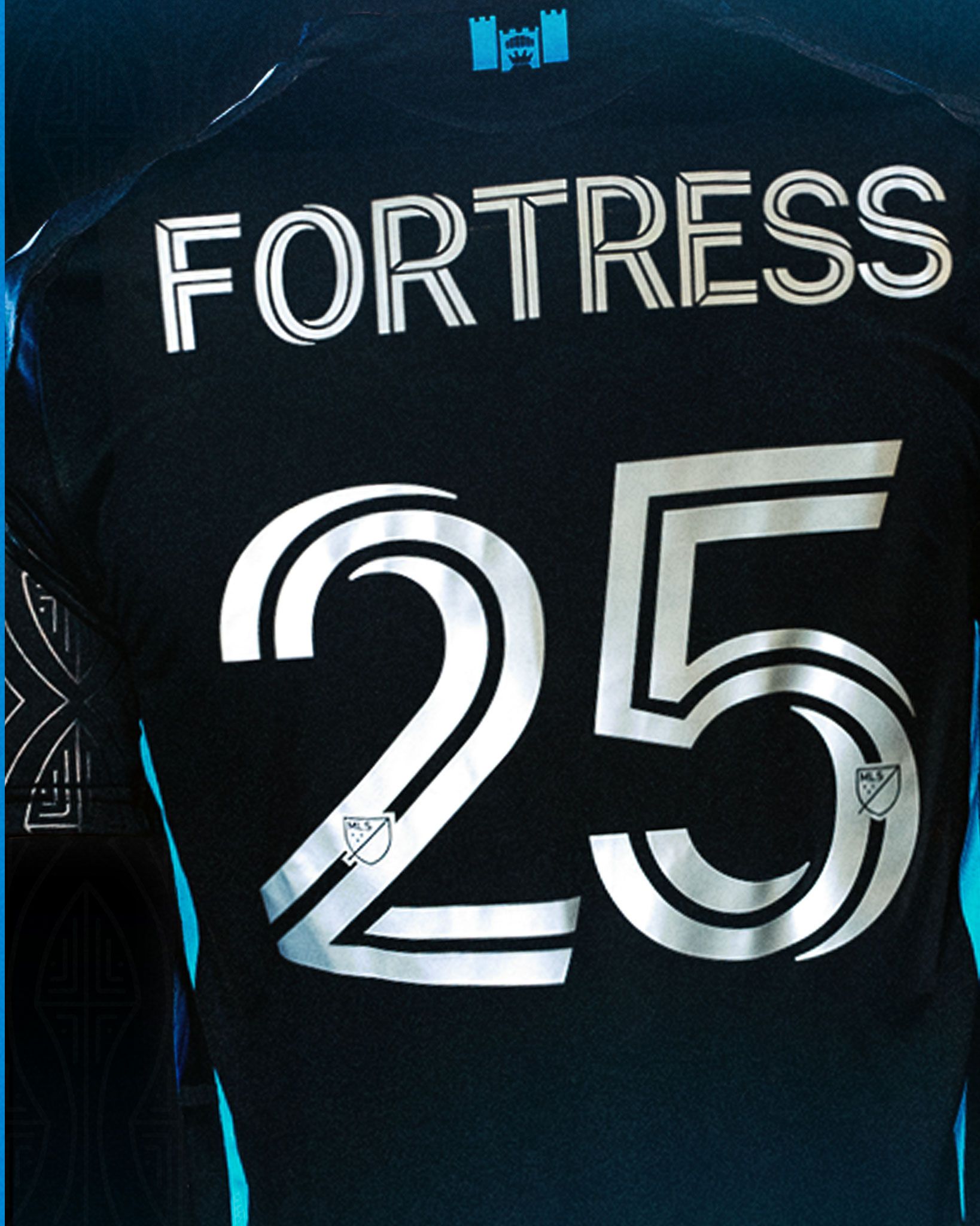 Charlotte FC Fortress Kit black jersey back showing silver FORTRESS name and number 25.