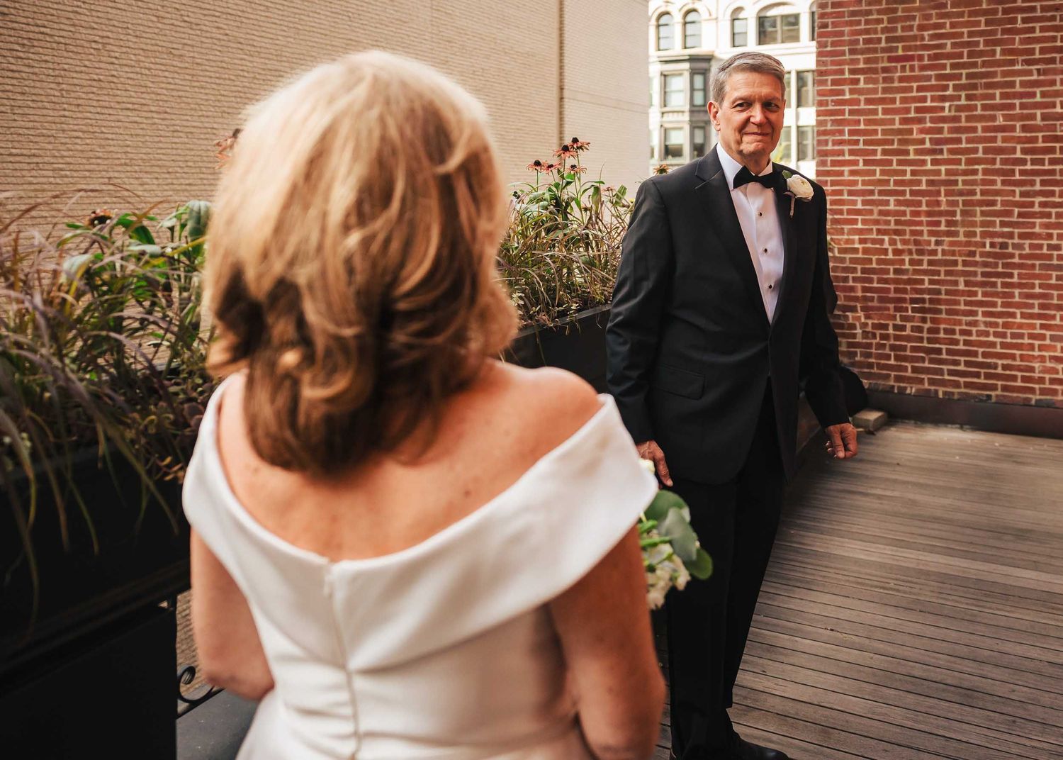 Emotional father of the bride seeing his daughter for the first time during wedding day at Lenox Hotel Boston