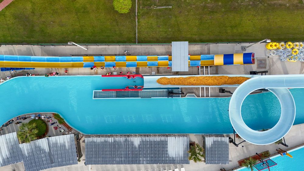 A series of swimming pool images showing blue water, pool decks, and aquatic facilities at a recreation center.