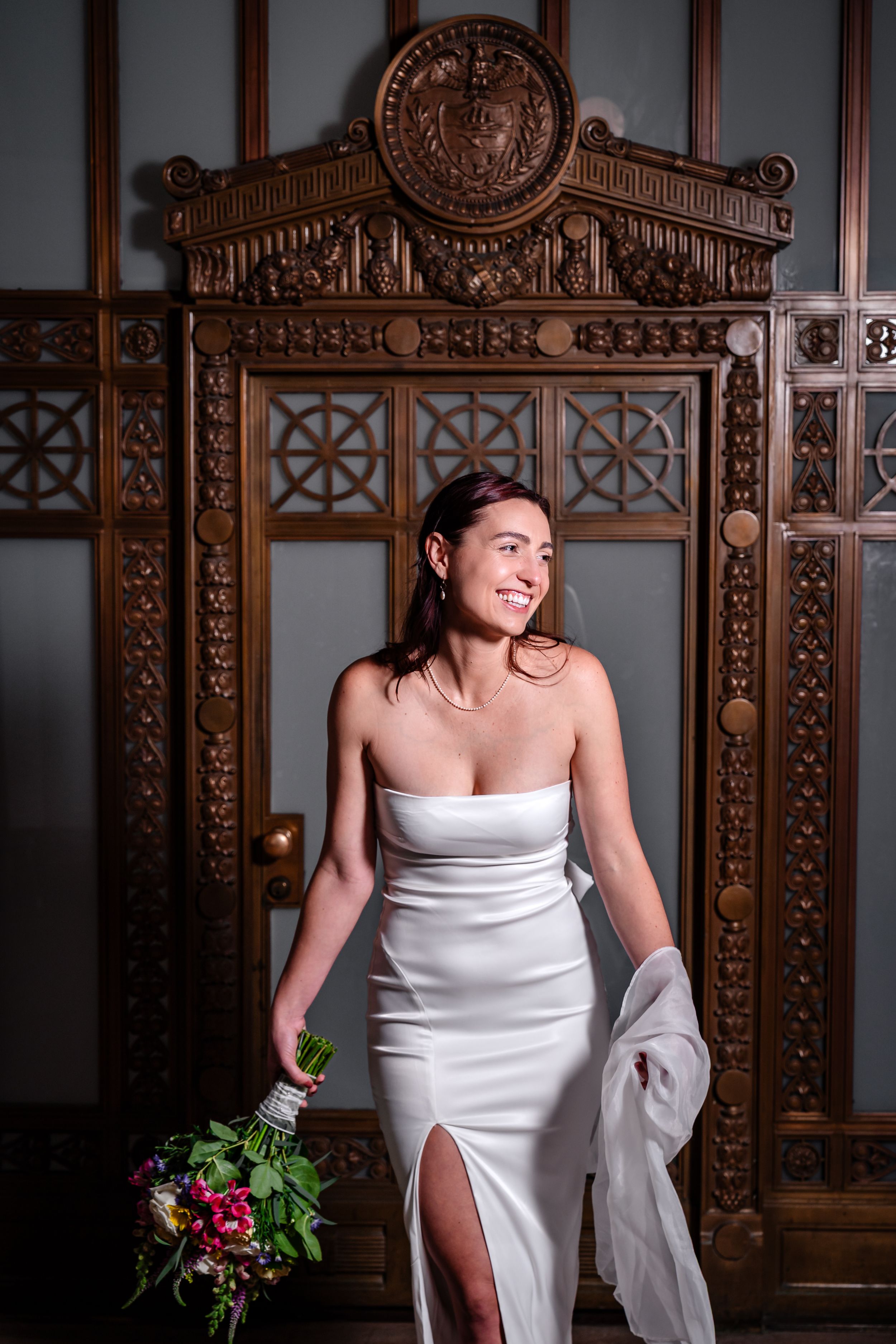 Bridal photo sequence against an intricately carved wooden wall with decorative patterns and warm lighting.