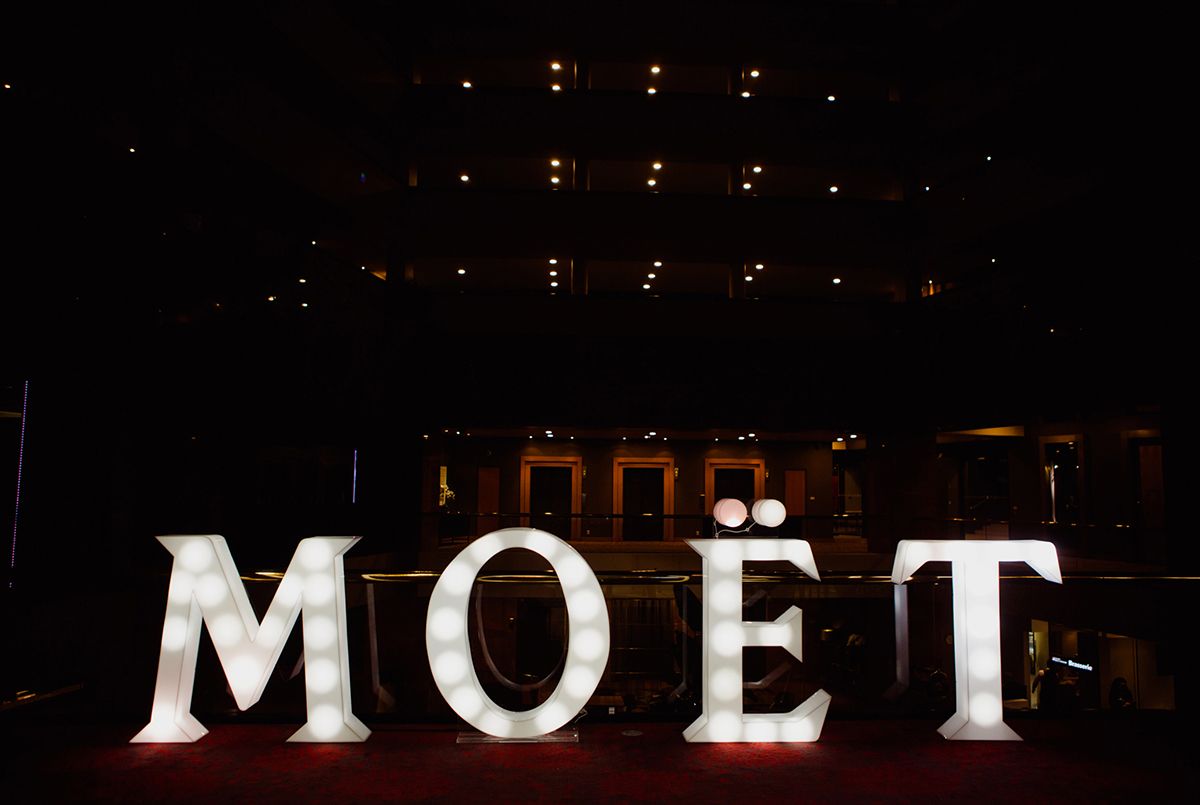 Sponsors branding at a charity gala dinner - Moet in neon lights