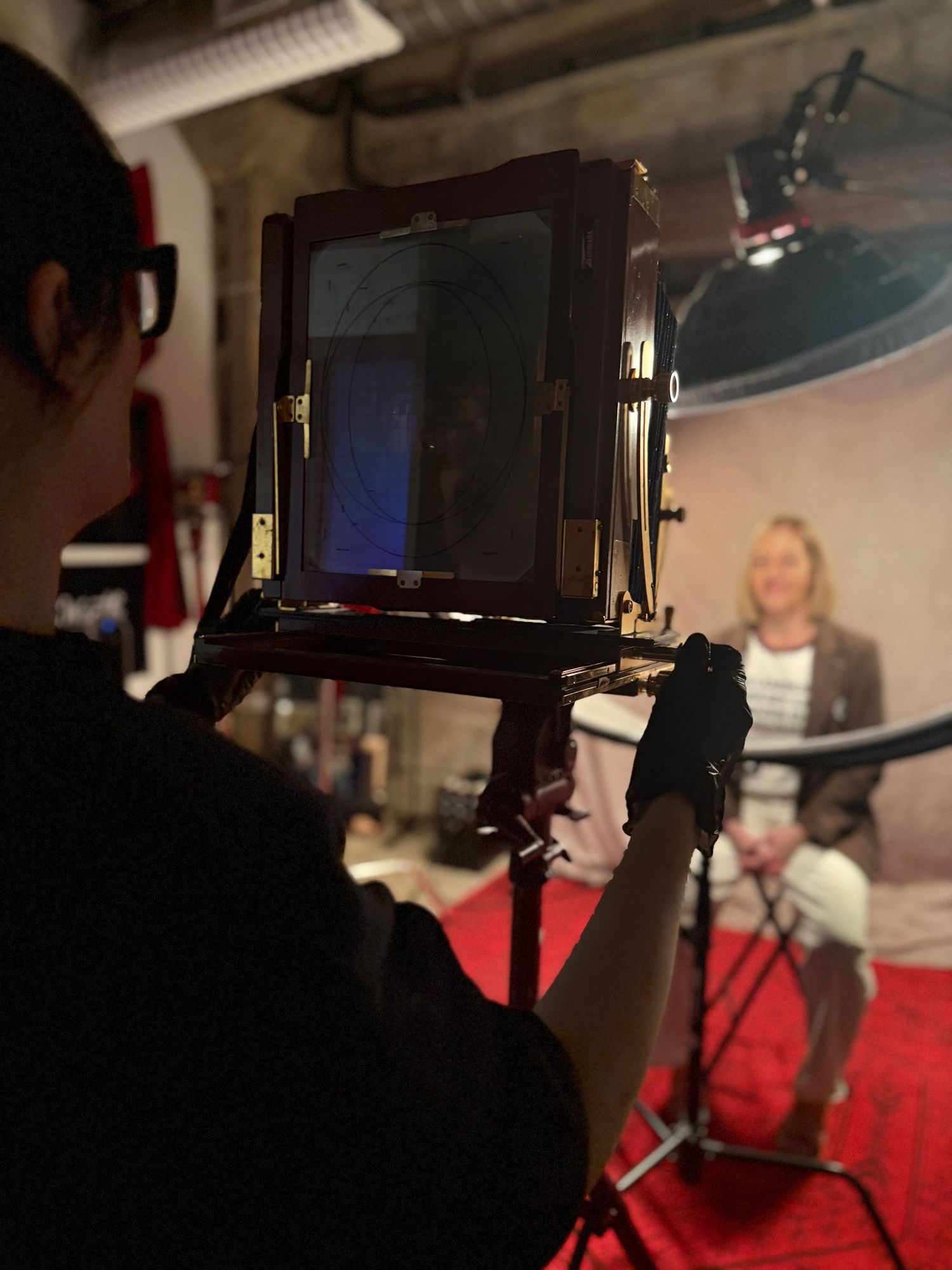Professional studio microphone setup with shock mount and pop filter shown in multiple angles against a dark background.