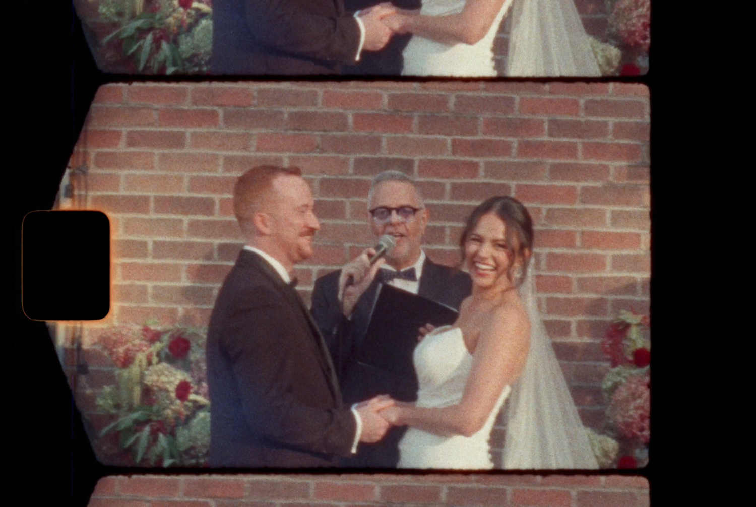A smiling bride and groom hold hands during their outdoor wedding ceremony in Old Port Montreal, captured on Super 8 film by Aliza Dworkind