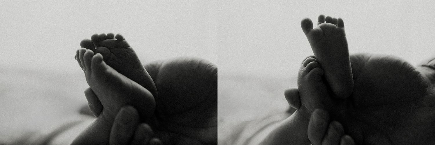 Black and white close-up photo of bare feet against a light background.