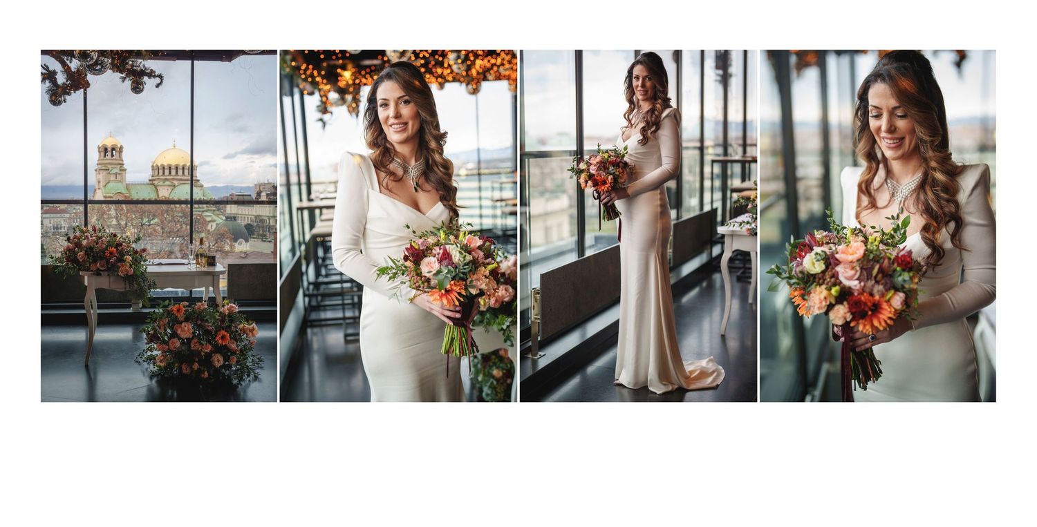 Elegant bride in fitted white dress poses with autumn bouquet against city skyline views.