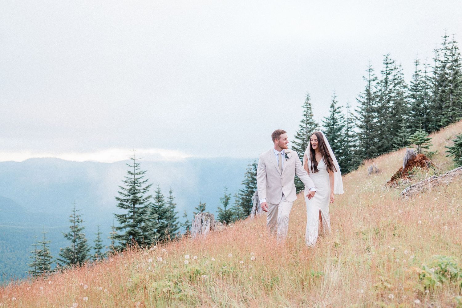 silhouette of a couple in front of Mt. Rainier. Photo by Pine + Vow