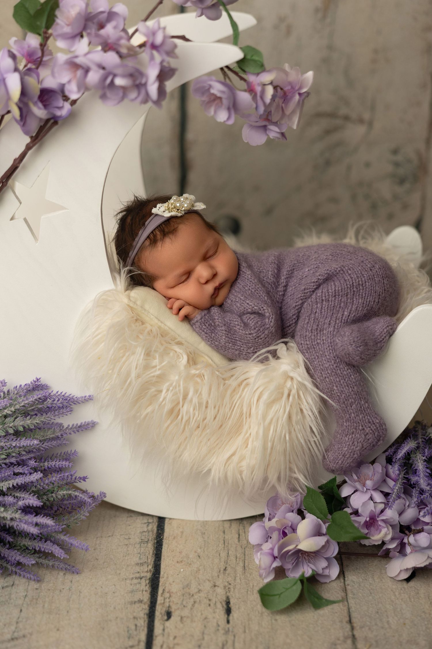 Newborn photography collage with purple flowers, lavender sprigs, and cream fur blanket against rustic backdrop.
