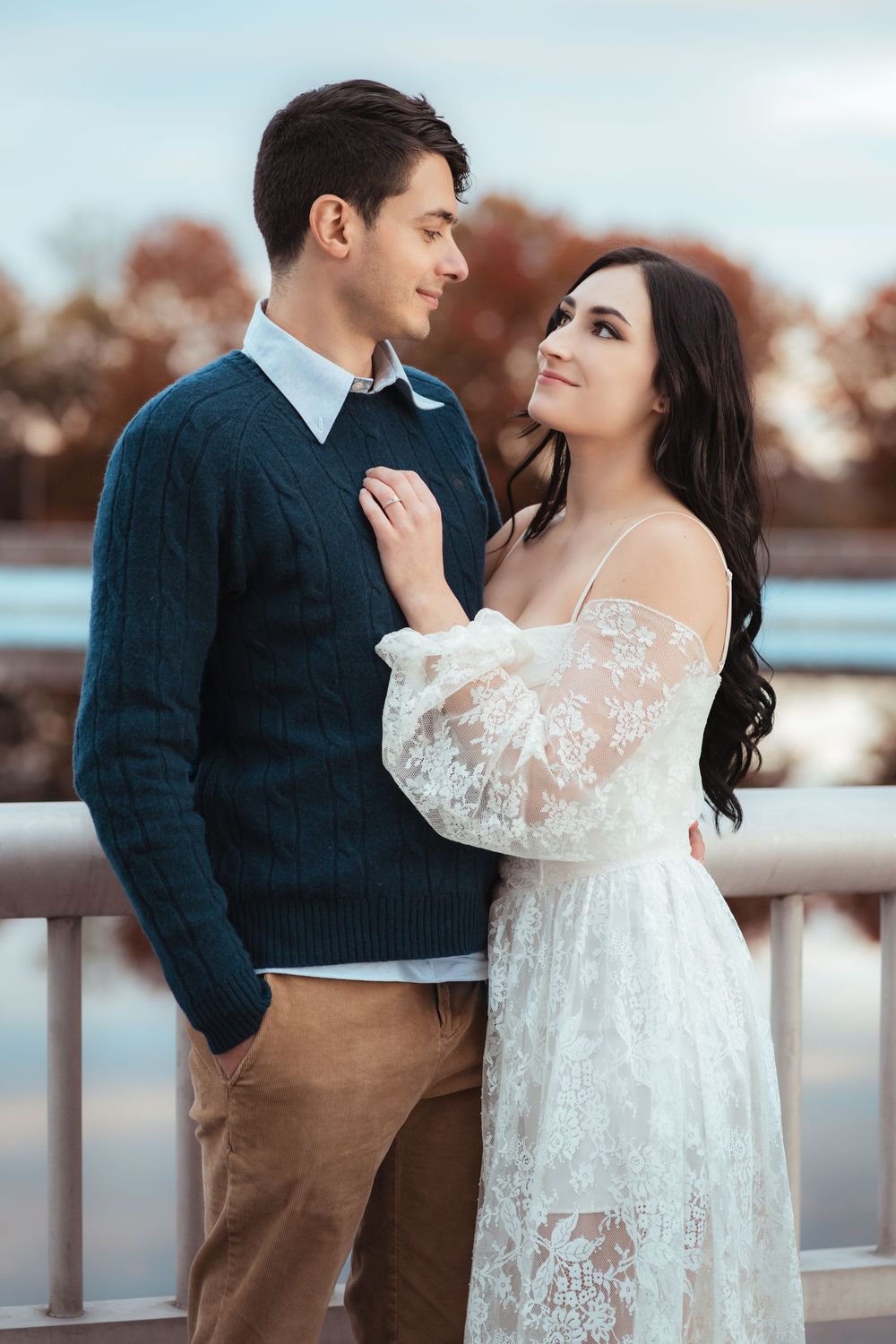 Couple gazing at one another during a golden hour engagement session.