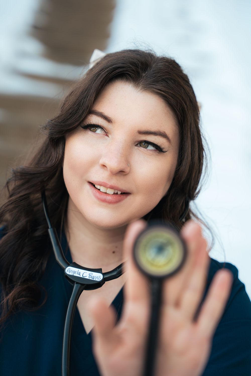 Professional portrait of medical student holding a stethoscope.