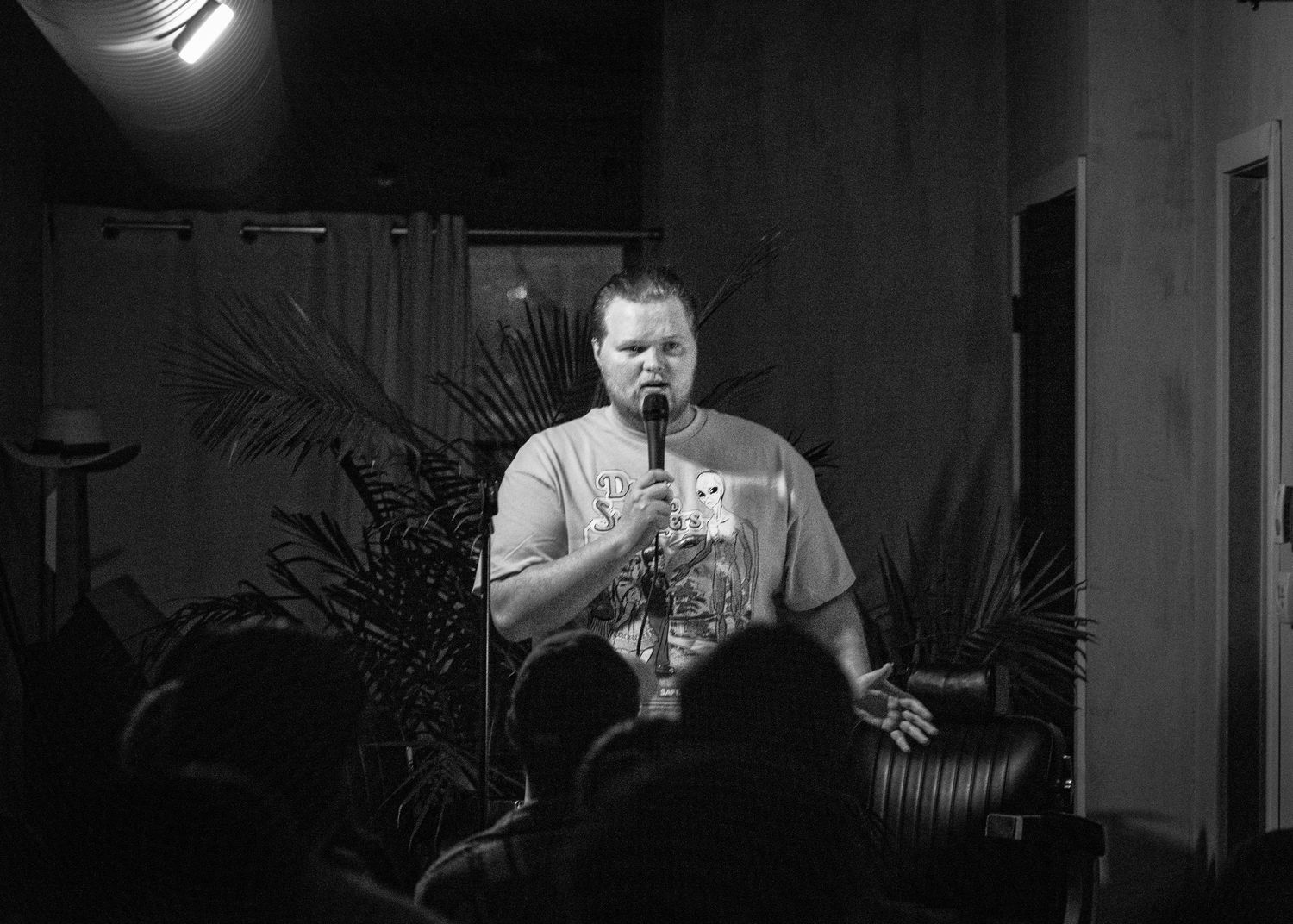Event photography capturing live moments from the 'Mess Produced' comedy show with performers on stage
