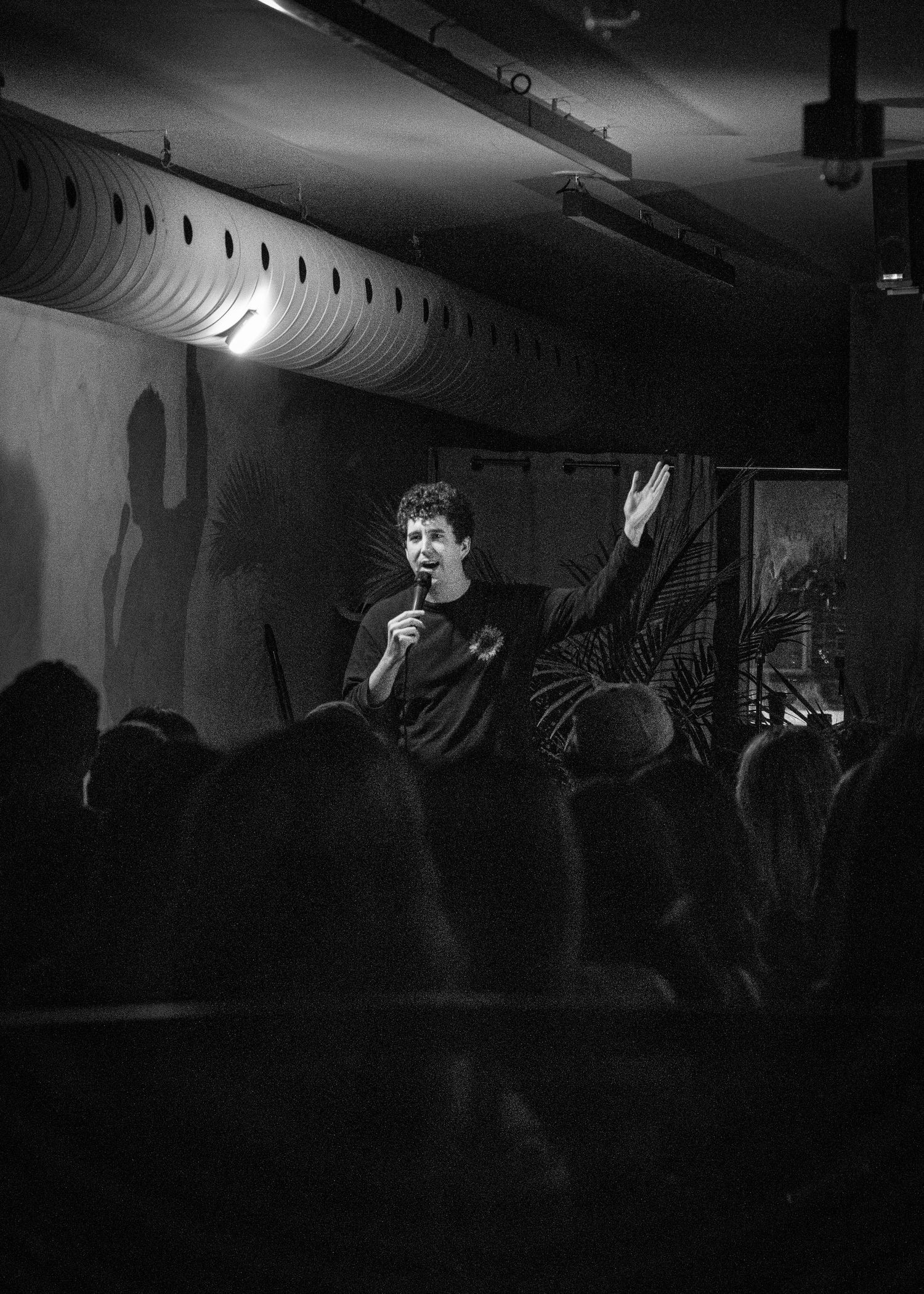 Event photography capturing live moments from the 'Mess Produced' comedy show with performers on stage